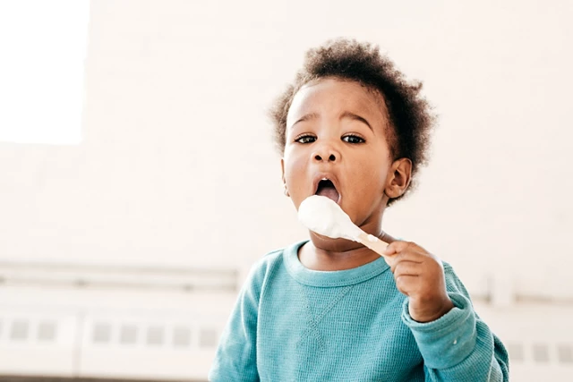 toddler with spon